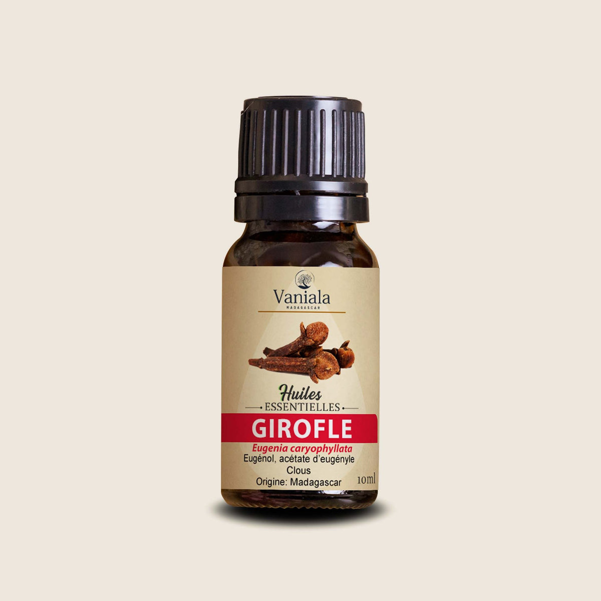Clove Essential Oil from Madagascar | Vaniala – essential oil bottle on beige background