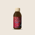Force One Tonic Solution from Madagascar | Vaniala – bottle of tonic solution on beige background