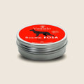 Fosa GM Balm Tin from Madagascar | Vaniala – aluminum tin of plant balm on beige background