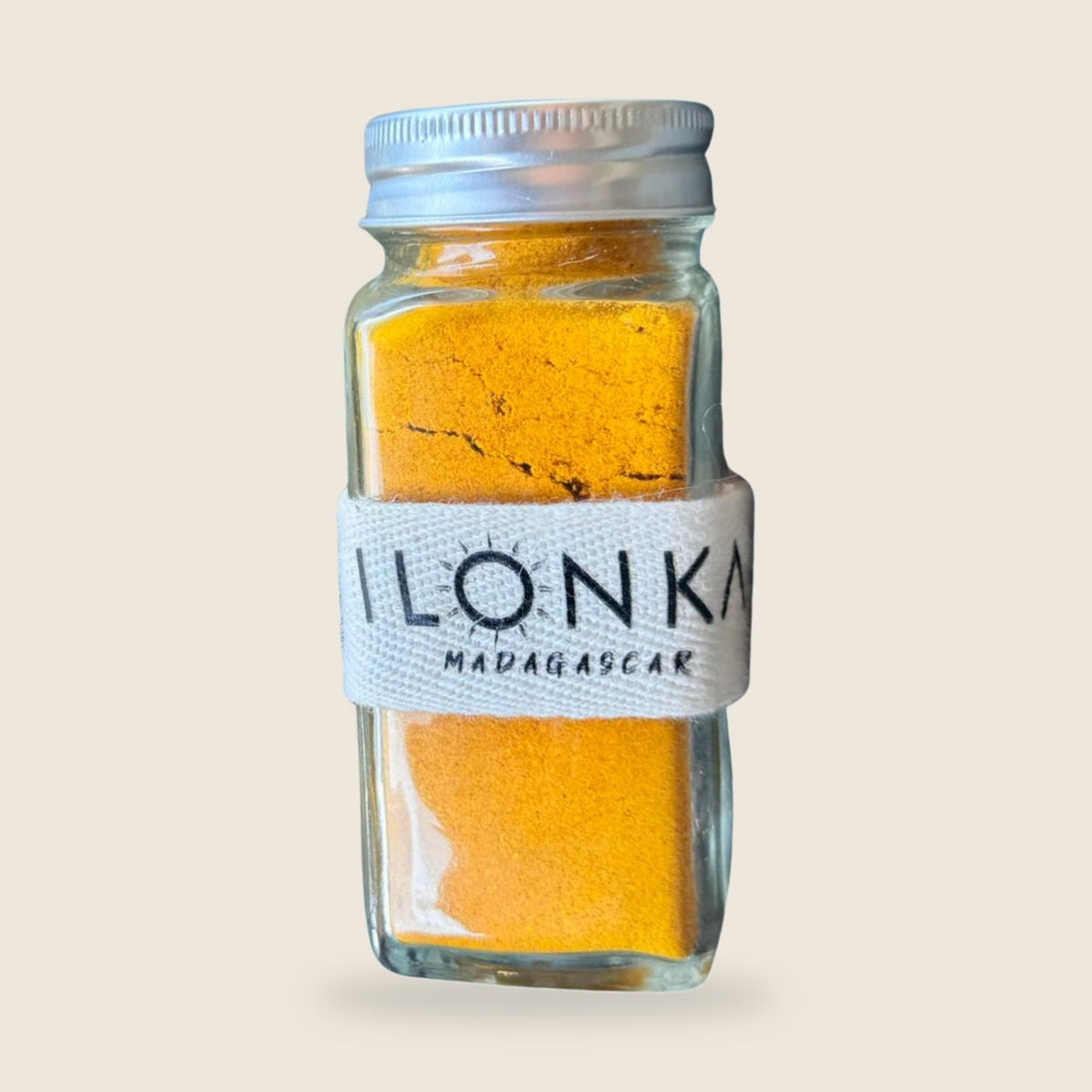 Turmeric Powder from Madagascar | Ilonka – glass jar on beige background