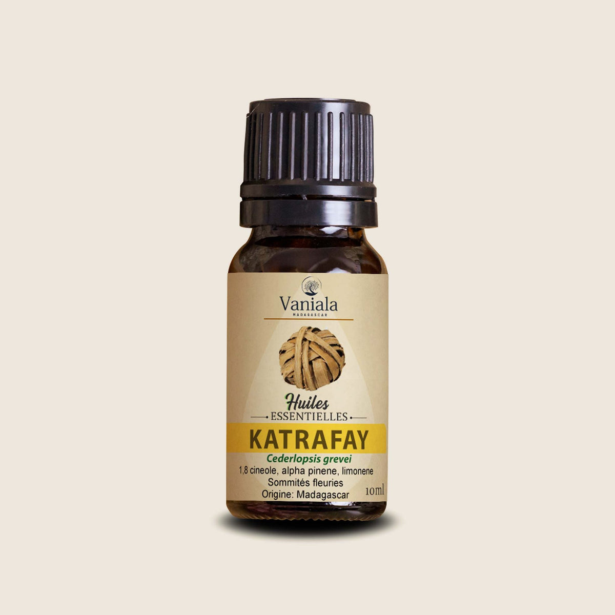 Katrafay Essential Oil from Madagascar | Vaniala – essential oil bottle on beige background
