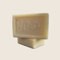Nosy Block Soap from Madagascar | Savonnerie Tropicale – two unwrapped Nosy soap blocks stacked
